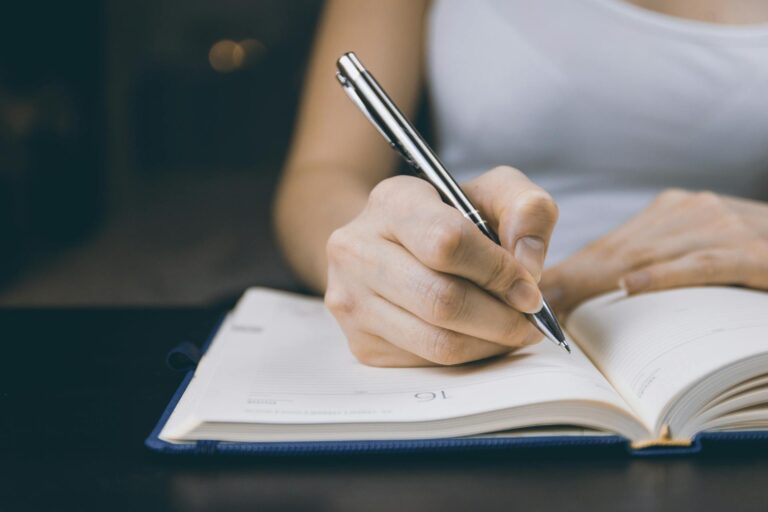 Woman Journaling To Manage Anxiety In A Relationship
